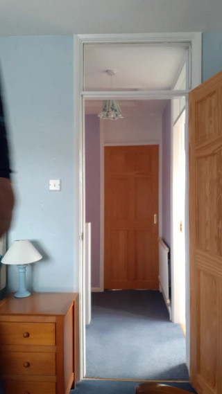Kazzie in dress in bedroom