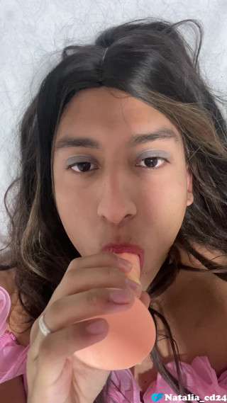 Natalia Valera uses her mouth to put a condom on her dildo and rides it thumbnail