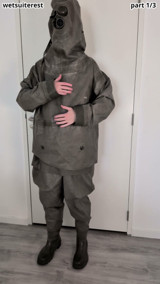 Putting on Zodiac Zodiak heavy rubber hazmat suit over plastic pants and gas mask