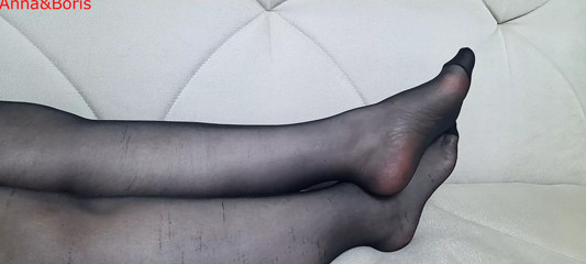 From another point of view, Anna's black pantyhose, legs and feet.
