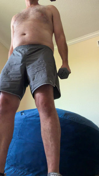 Lifting weights with my shirt off. My big sexy hairy chest is out in full force