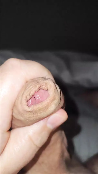Close up POV of uncut dick and cumshot