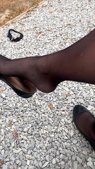 Shoe dangling outdoors in stockings thumbnail