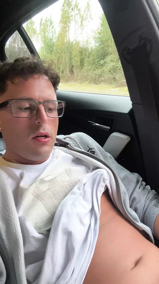 Really cute twink boy jerks off his stinky cheese-smeared penis outside in the car until he cums