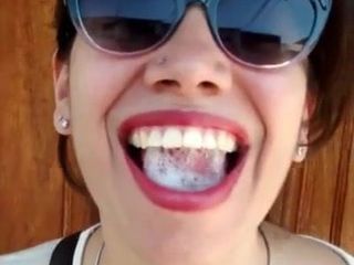 Pretty Girl Plays With A Mouthful Of Cum On The Street