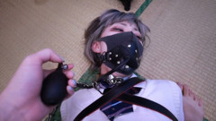 Barefoot Girlfriend Is Strapped with Leather Gear and One Hand Is Restrained, with an Inflation Plug