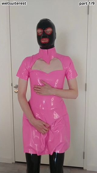 Putting on pink latex maid dress over rubber stockings and transparent pants thumbnail