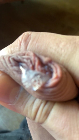 Uncut precum closeup 1