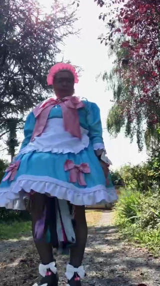In a blue maid outfit with pink bows for a day thumbnail