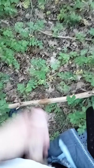 Boy pisses next to the train tracks