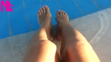 Barefoot Dangling in Swimming Pool Water