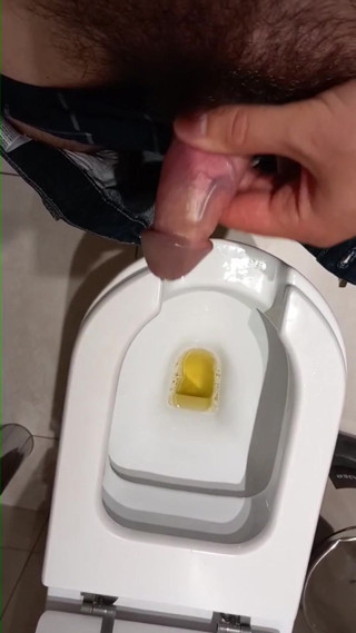 A cumm with a big cock in the work bathroom.