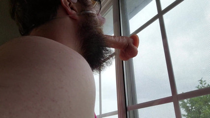 Exposed sissy pig in window sucking dildo