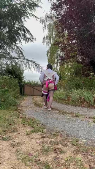 In a gardener outfit with a pink dress for a day