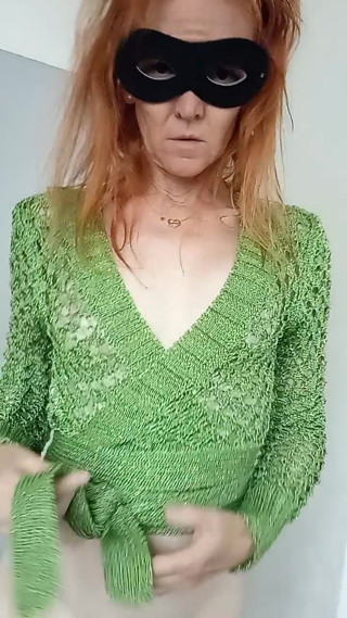 In green cardigan with chunky knits