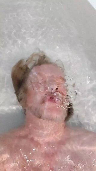 Another bath in a yellow thong
