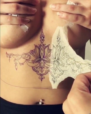 big tits babe getting inked