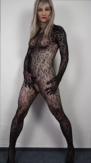 Sexy Blonde Crossdresser in Bodystocking with Butt Plug