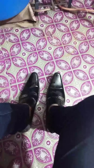 Leather Boot black shining and feet.