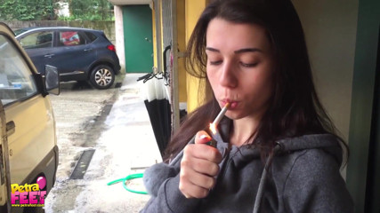 Outdoors smoking from the stunning brunette