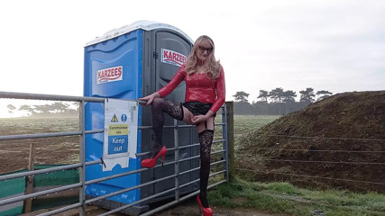 PVC Wearing Crossdresser Outdoors Posing and Pissing