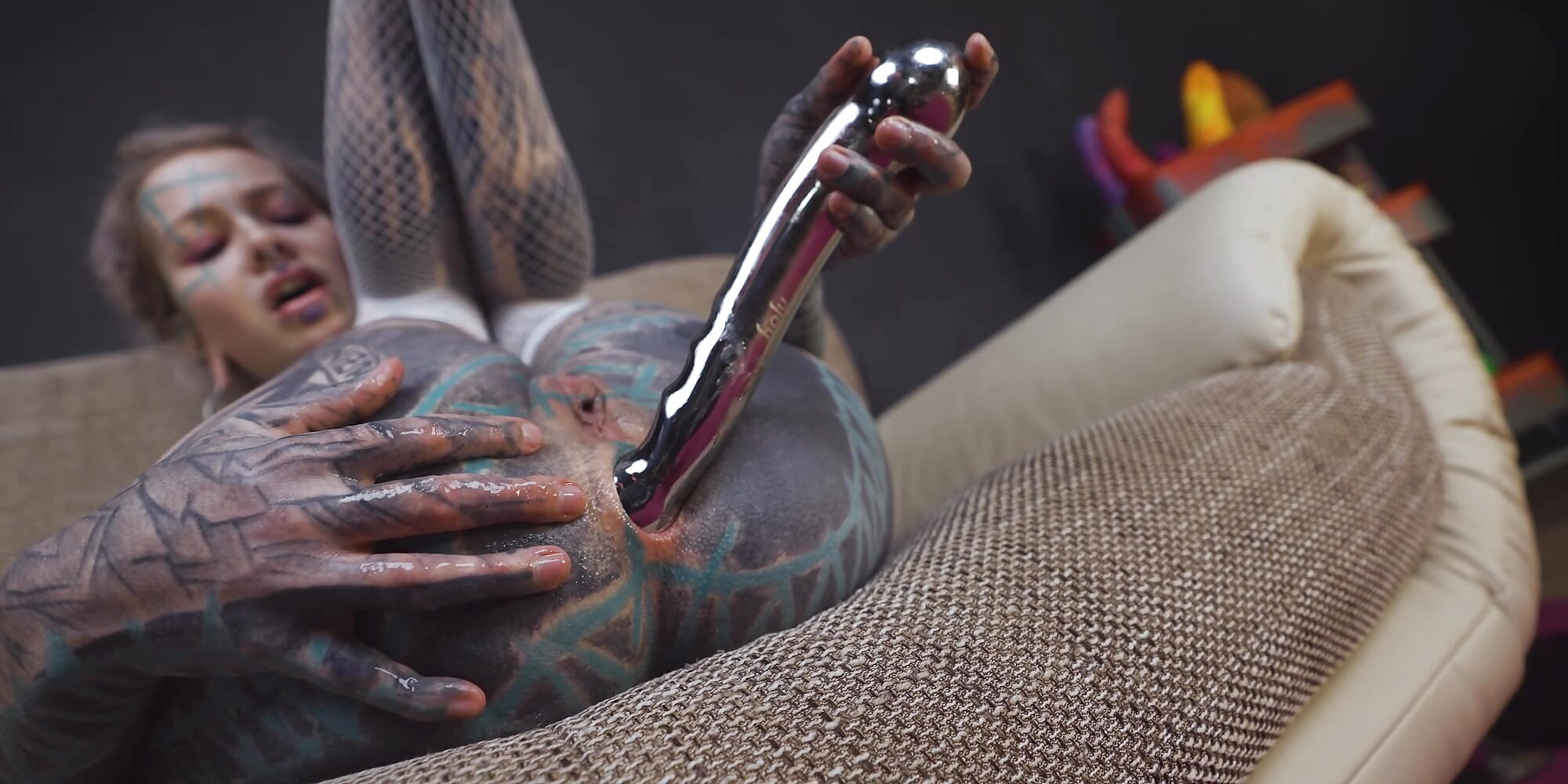 Anuskatzz grabs her cold, stainless steel toy and slides it deep into her tight ass
