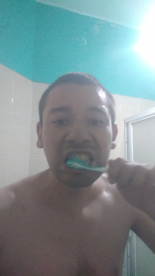 Man washes his face