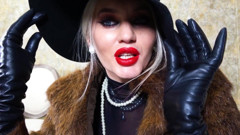 Femme fatale wearing fur coat and leather gloves