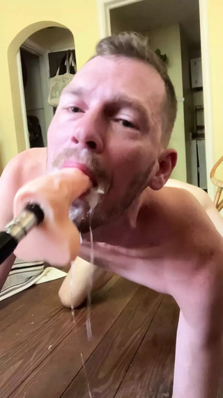 Faggot gags and spits on deep throat fuck machine dildo
