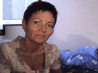 Short haired German lady pleasing her hairy muff with a dildo