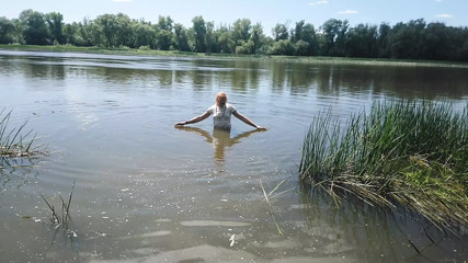 Alexa Cosmic transgirl swimming in clothes in river in jeans shirts and white t-shirt. Alexa Cosmic Wetlook Lover.