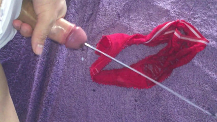 Massive Cumshot on red Thong