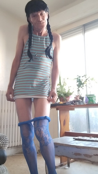 Just a little dress (blue, matching the tights) and brown pigtail, and stark naked underneth...!!... Come see!!... and tell me