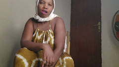 horny black woman masturbates in her living room while she is alone