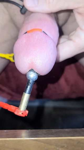 A Sounded estim session with a super close-up cumshot