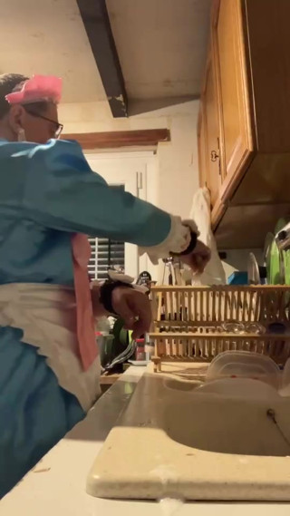 In a blue maid's outfit with pink bows to do the dishes. thumbnail