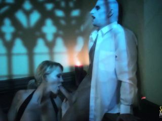 A pale vampire pounds the blonde milf with big tits on the staircase before giving her a facial