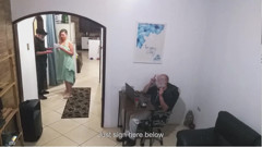 While the Husband Works, the Wife in a Towel Greets the Delivery Man