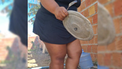 Hot neighbor prepares lunch in the backyard, and shows her pussy outdoors