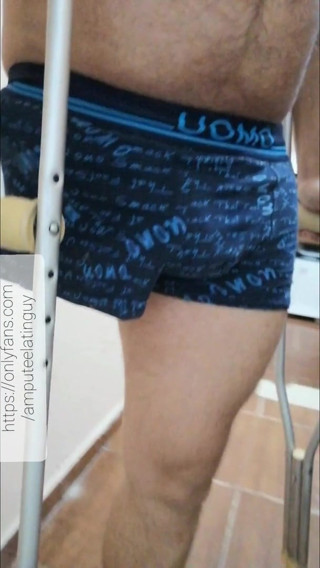 Amputee guy walking in underwear