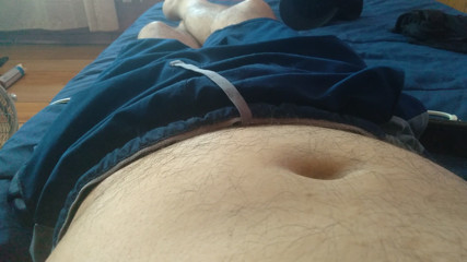 young strongman touches his fat penis, fully aroused