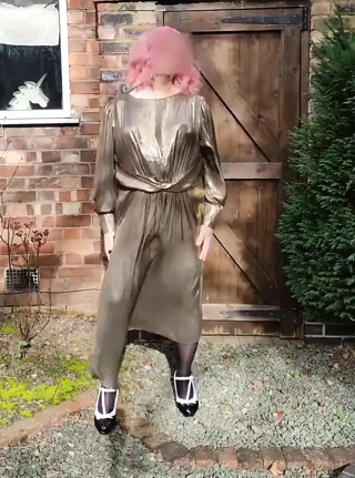 Hot crossdresser in gold metallic dress
