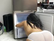 Filming the voluptuous maid cleaning the fridge