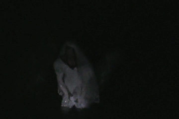 big wedding gown in a ditch at night