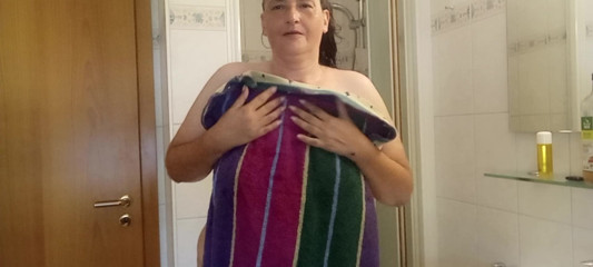 Mature German MILF 52 showers a chubby body under the shower