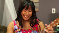 engaging in a sensuous physical encounter with her Asian lesbian companion