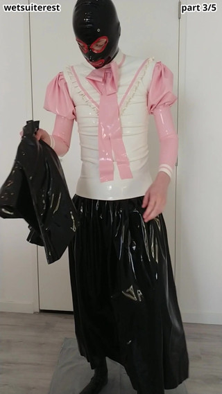 Putting on another long latex skirt over skirt, blouse, rubber maid stockings and transparent panties, latex layers thumbnail