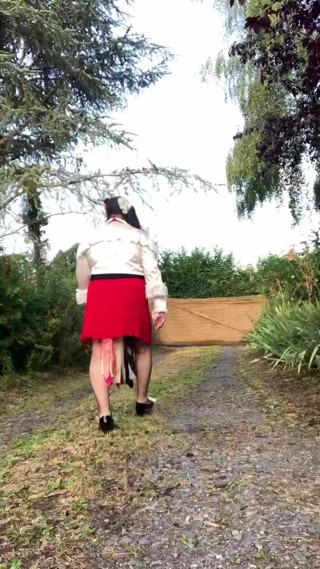 In an outfit with a little red skirt and a new blouse for an evening out. thumbnail