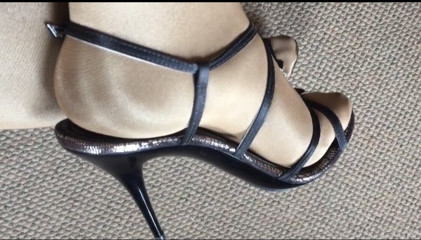 Showing my sexy legs wearing shiny glossy pantyhose and sexy high heeled sandals. thumbnail