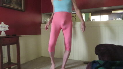 Crossdresser in skin-tight spandex leggings.